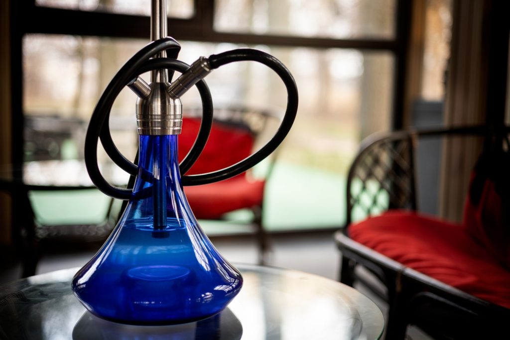 Blue and black glass pipe available near The Pearl
