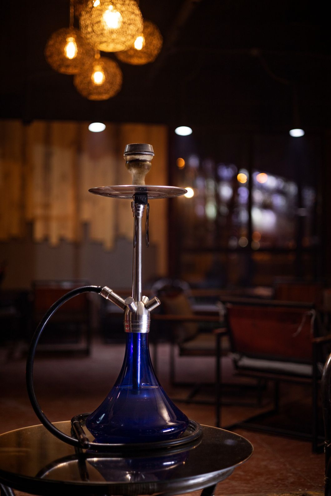Modern shisha pipe with elegant smoke swirl at a Mayo Meadow shisha store