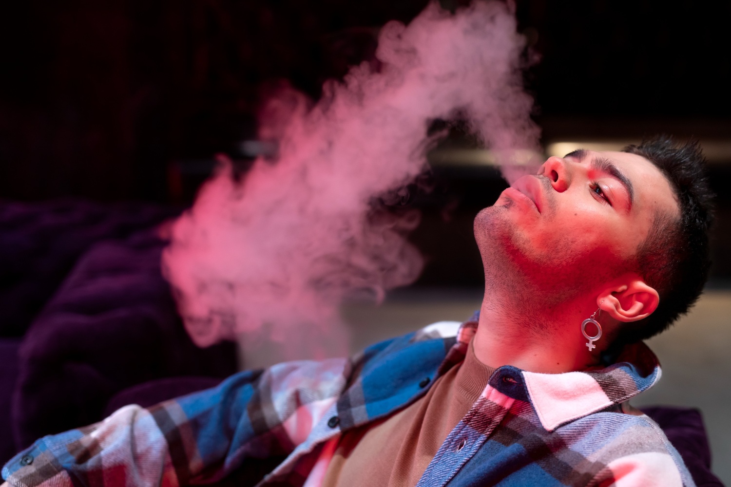 Teen using a vape nicotine pods near Renaissance