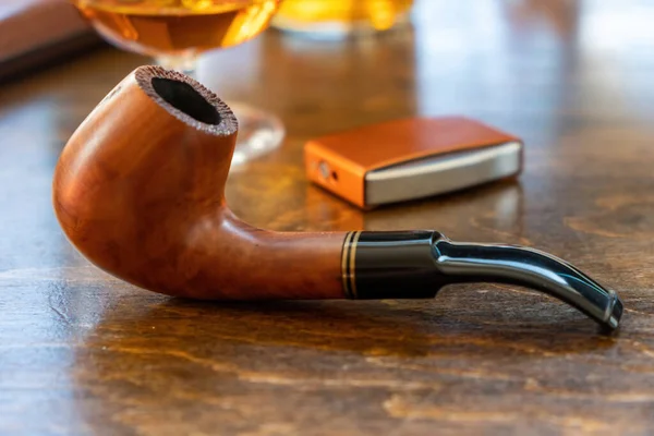 Close-up of a wooden brown design glass pipe near Swan Lake neighborhood