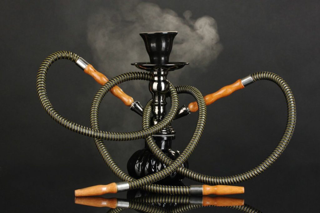 Black hookah with smoke, a top choice for customers at a Smoke Shop Tulsa offering quality smoking gear.