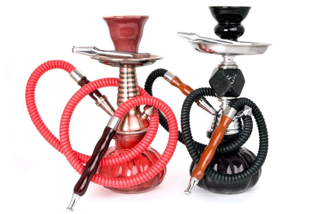 Red and black hookah pipes available at a Smoke Shop Tulsa, perfect for enjoying flavored tobacco.