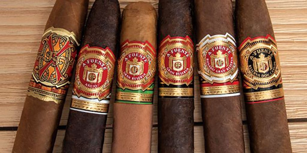 cigar shop tulsa selection of arturo fuente gran reserva cigars on wooden table showing different bands wrappers and size