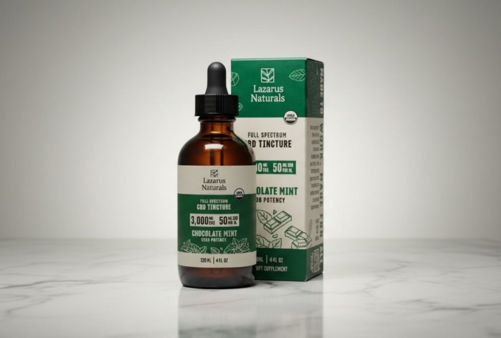 Bottle and box of Lazarus Naturals Full Spectrum CBD Tincture in Chocolate Mint flavor on marble. Available at a cbd store tulsa.

