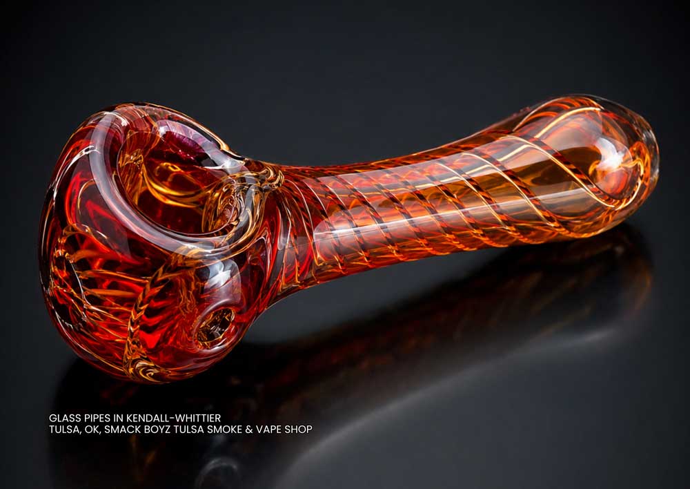 Vibrant amber and red swirl hand-blown smoking pipe, available now in our selection of custom glass pipes Tulsa OK.