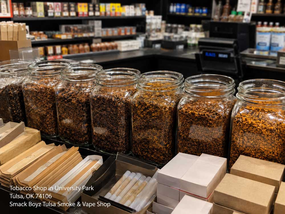 Large glass jars filled with various loose blends on the counter of a local tobacco shop Tulsa location.