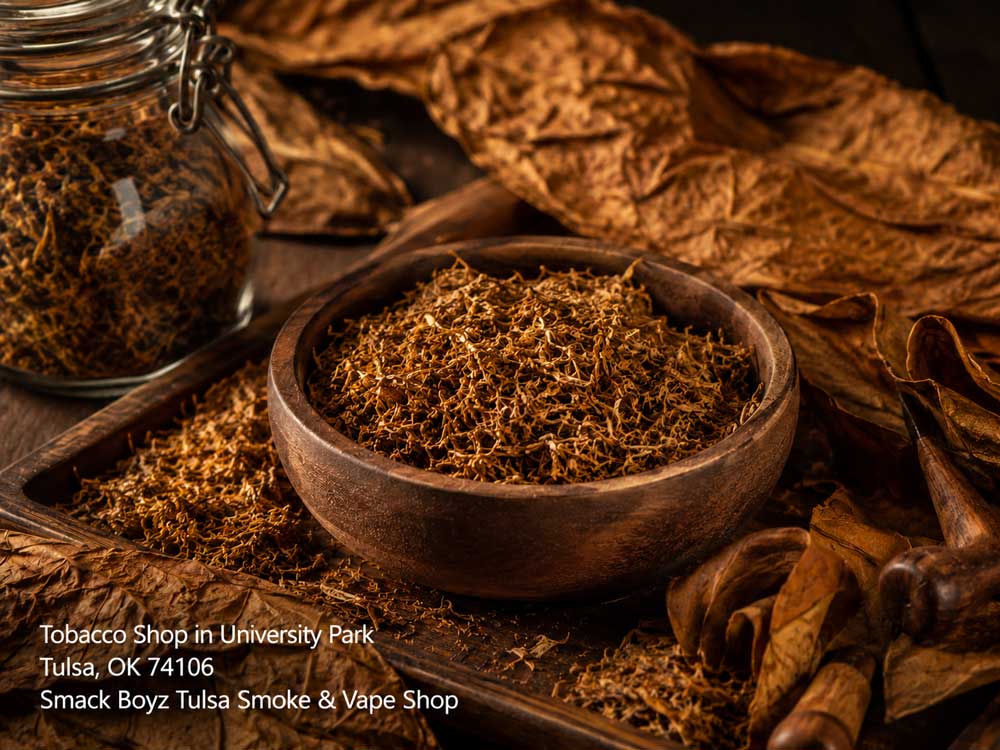 Loose tobacco blend inside a wooden bowl at a premium tobacco shop Tulsa, featuring cured rolling leaves.