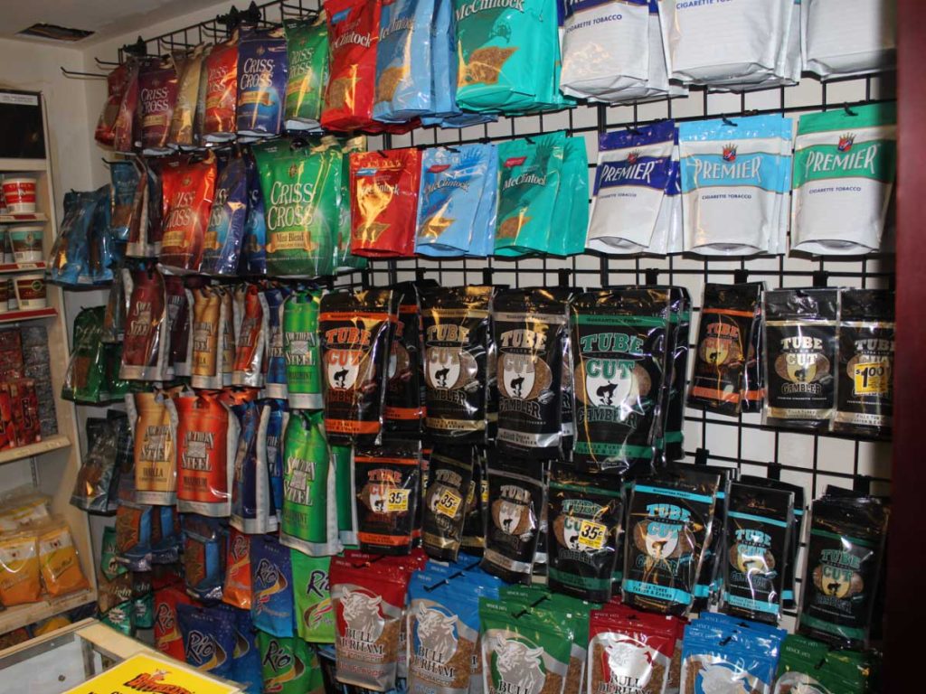 Diverse tobacco products displayed on shelves at a tobacco shop Tulsa, offering a wide range of smoking options.