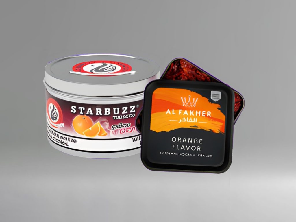 Starbuzz and Al Fakher orange tobacco tins, popular products at a Smoke Shop Tulsa for hookah enthusiasts.