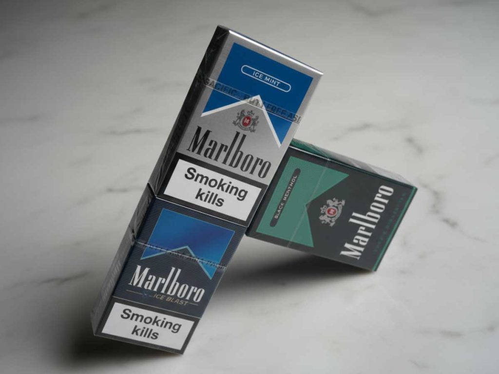 Marlboro Ice Mint and Black Menthol cigarette packs on display at a cigarette shop Tulsa, showcasing popular menthol options.