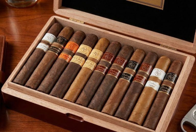 Cigar shop Tulsa features Rocky Patel sampler box with tasting journal and cutter for refined cigar loverS