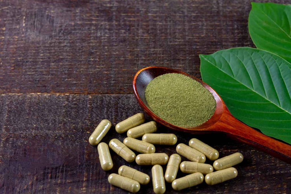 Fresh leaves and herbal capsules displayed at a kratom shop Tulsa customers choose for natural botanical options.