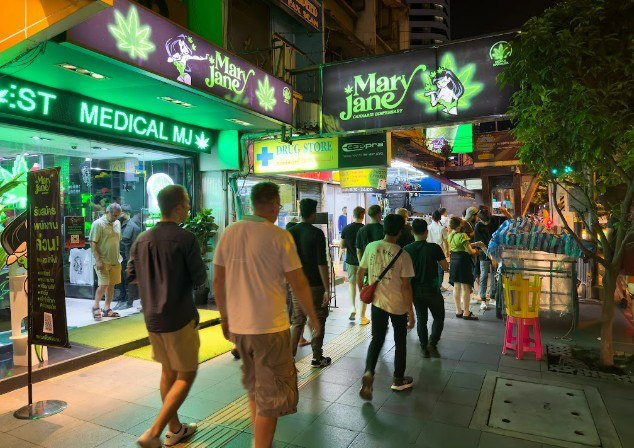 Vibrant nightlife outside a legal medical marijuana and smoke shop Tulsa cannabis dispensary.